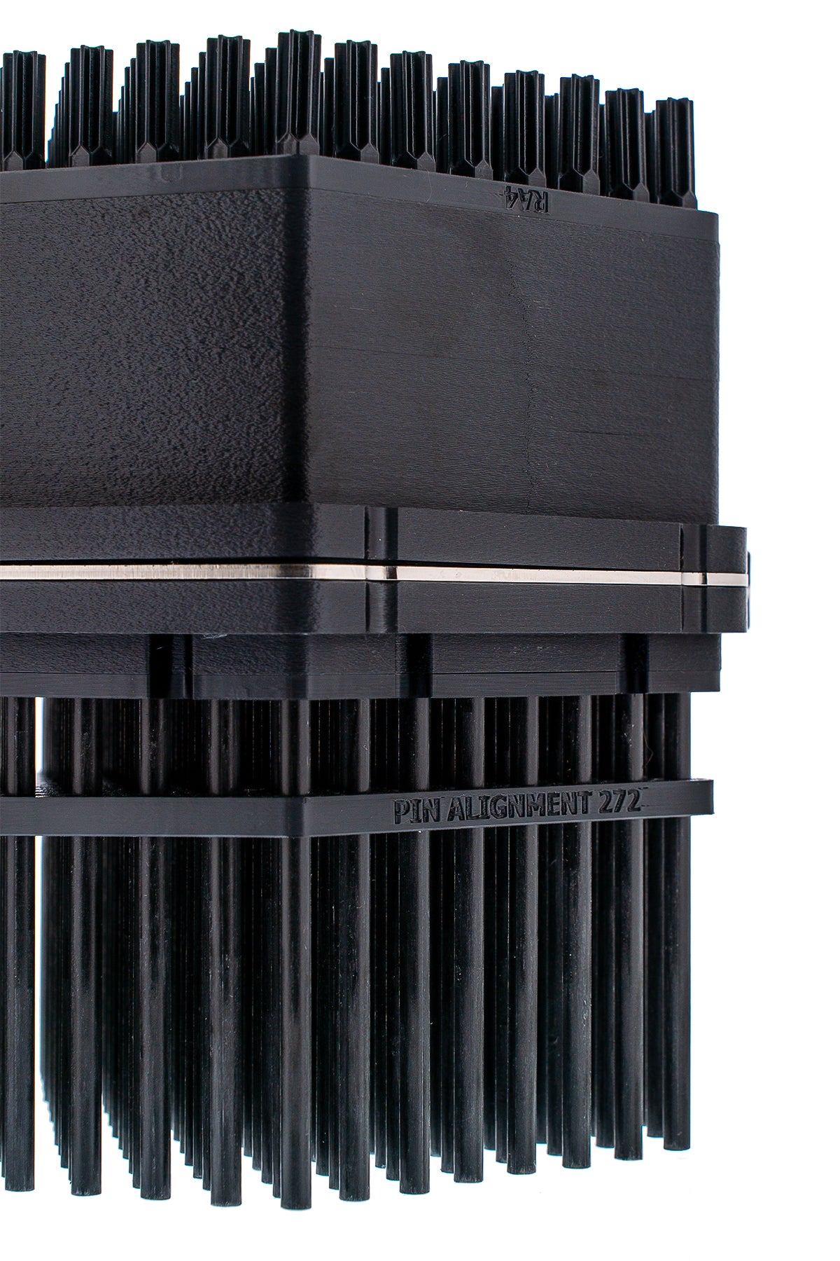  Side/Corner Close-Up. Shows the housing, metal plate seam, alignment frame, and lower pins.